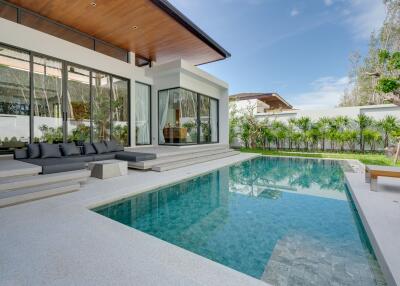 Modern home with a swimming pool and patio furniture