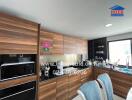 Modern kitchen with wooden cabinetry and appliances