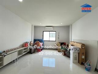 Spacious living room with bright white walls and floor