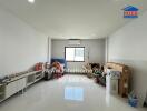 Spacious living room with bright white walls and floor