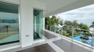 Spacious balcony with railing and tiled floor