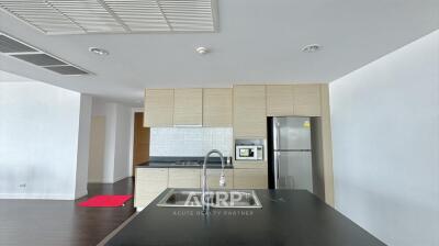 Modern kitchen with wooden cabinets and stainless steel appliances