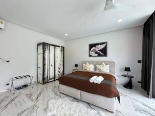 Modern bedroom with comfortable bedding and minimalist decor