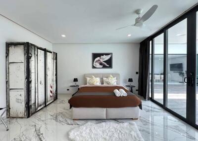 Modern bedroom with large windows