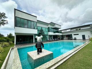 Modern house with large swimming pool and glass windows