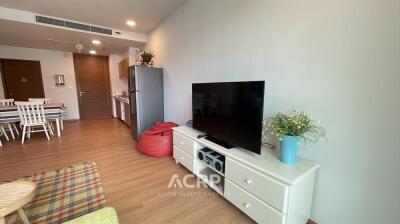 Modern living room with dining area and kitchen