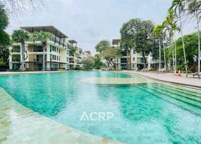 Modern apartment buildings with a large swimming pool