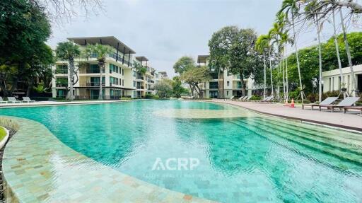 Modern apartment buildings with a large swimming pool