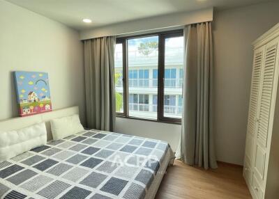 Bright and cozy bedroom with a large window