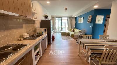 Spacious open-plan kitchen and living area with modern furnishings