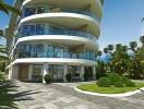 Modern apartment building exterior with lush greenery