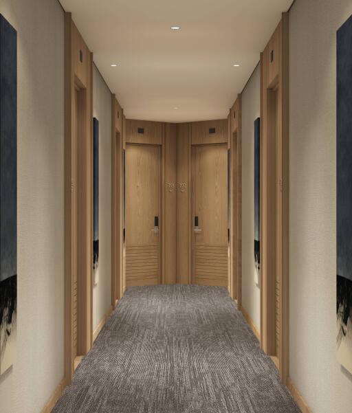 Hallway with multiple doors and carpeting