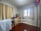 Bedroom with parquet flooring and natural light