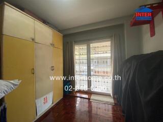 Bedroom with large wardrobe and a balcony view