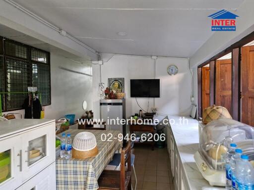 Traditional kitchen setup with dining table and appliances