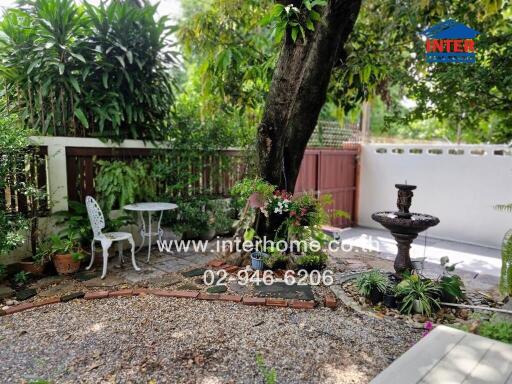 Peaceful garden with seating area and fountain