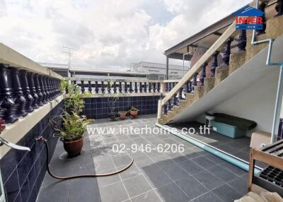 Outdoor terrace with plants and stairs