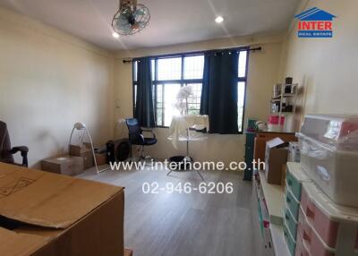 Bedroom with boxes and shelves