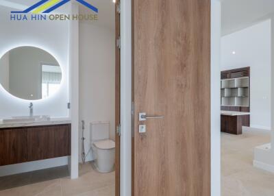 modern bathroom with wooden cabinets