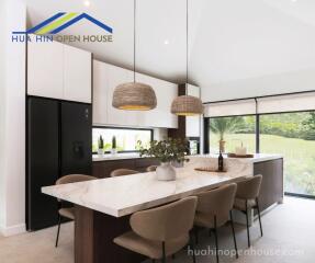 Modern kitchen with island and dining area