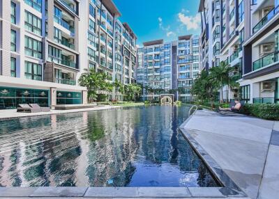 Modern residential building with a large outdoor swimming pool