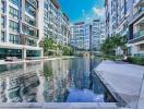 Modern residential building with a large outdoor swimming pool