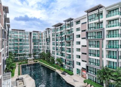 Modern apartment complex with large outdoor pool