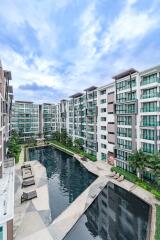 Modern apartment complex with large outdoor pool