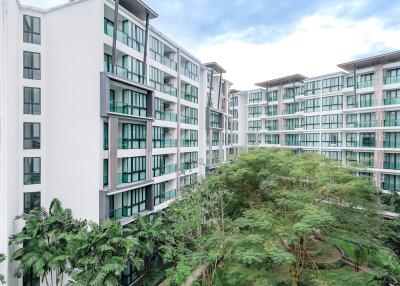 Modern apartment buildings with green landscaping