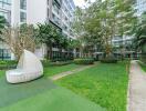 Exterior view of modern apartment complex with landscaped garden