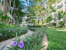 Modern residential building with lush green landscaping