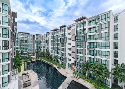 Exterior view of modern residential complex with a swimming pool