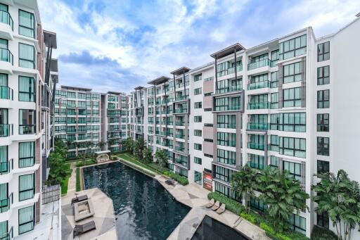 Exterior view of modern residential complex with a swimming pool