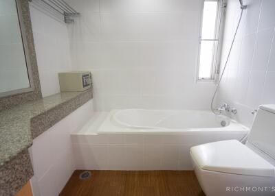 Modern bathroom with bathtub and vanity area