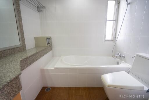 Modern bathroom with bathtub and vanity area