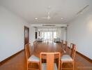 Spacious dining area with a wooden table and chairs