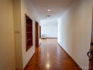 Bright hallway with wooden floors and built-in shelves