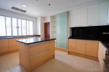 Modern kitchen with ample natural light and island