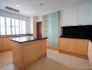 Modern kitchen with ample natural light and island