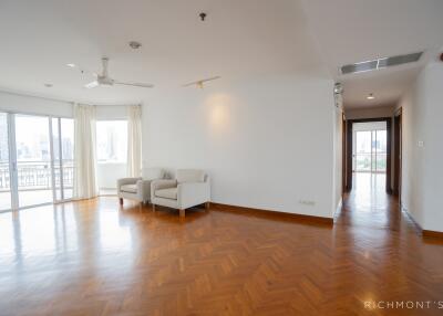 Spacious and bright living room with wooden flooring.