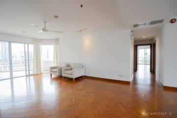 Spacious and bright living room with wooden flooring.