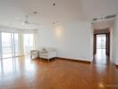 Spacious and bright living room with wooden flooring.