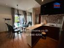 Modern kitchen and dining area with chandelier and large windows