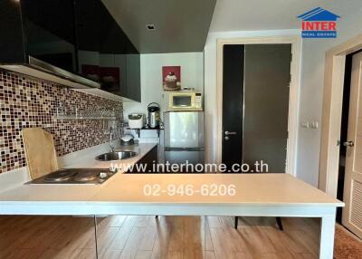 Modern kitchen with appliances and tiled backsplash