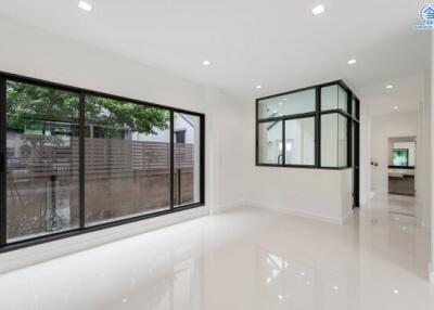 Spacious living room with large windows