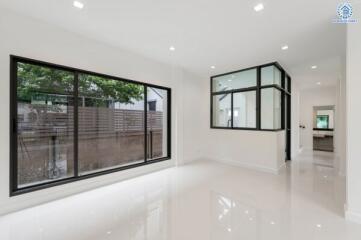 Spacious living room with large windows