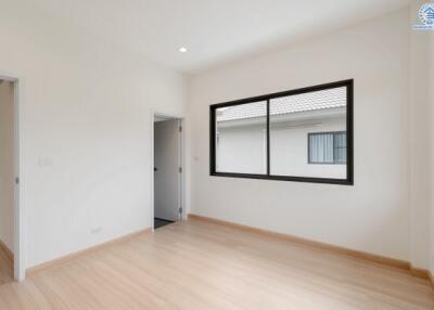 Bright and spacious bedroom with large window