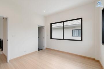 Bright and spacious bedroom with large window