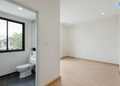 Empty bedroom with an attached bathroom