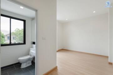 Empty bedroom with an attached bathroom